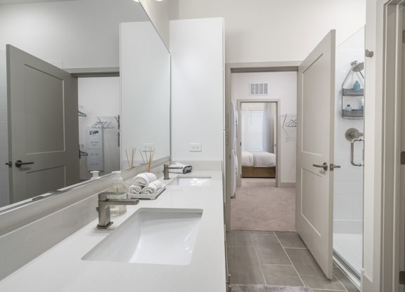 a bathroom with a sink and a shower at Artistry at Winterfield Apartments, Virginia