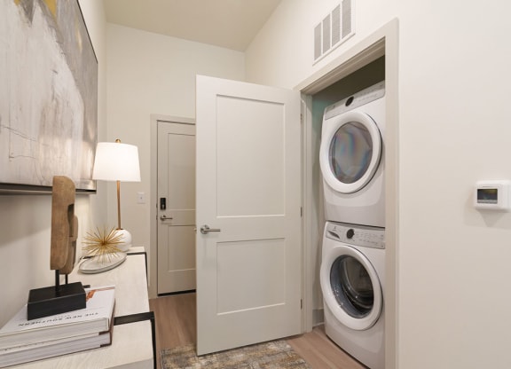 a front load washer and dryer in a laundry room at Artistry at Winterfield Apartments, Midlothian, VA, 23112
