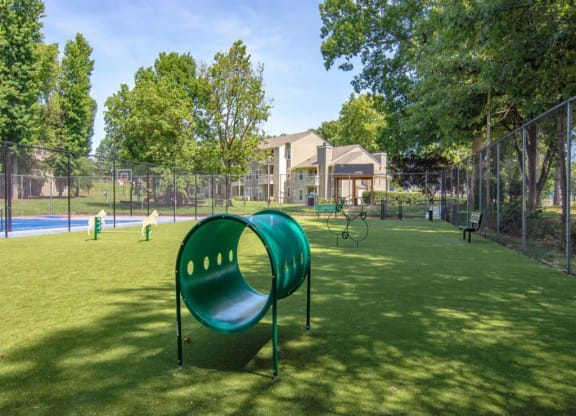 our apartments showcase a dog park with plenty of room to run and play at Hunters Chase Apartments, Virginia