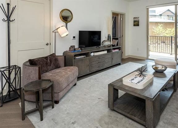 Spacious living rooms with sliding glass doors to balcony at 2000 West Creek Apartments, Virginia, 23238