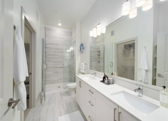 a bathroom with two sinks and a shower at Tapestry West, VA 23230