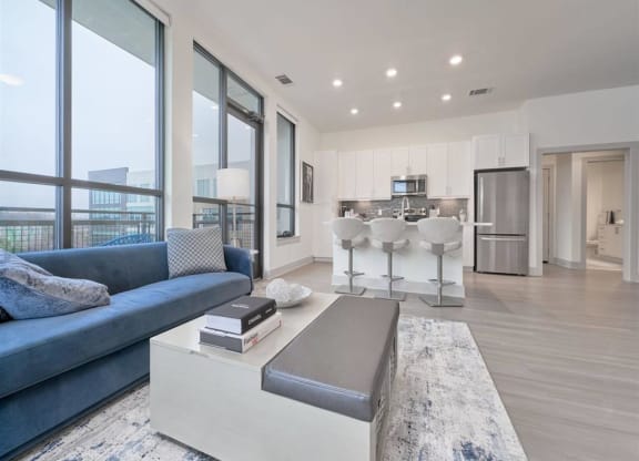 a living room with a couch and a coffee table at Tapestry West, Virginia, 23230