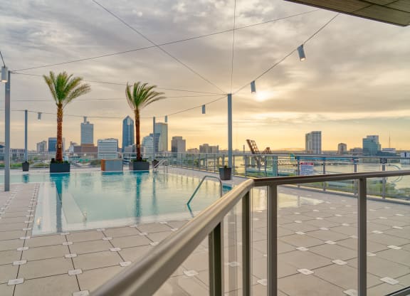 the swimming pool on the roof of a building with the city skyline in the background at Vista Brooklynn Apartments, Florida