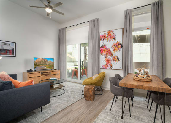 an open living room and dining room with a table and chairs at Vista Brooklynn Apartments, Florida, 32202