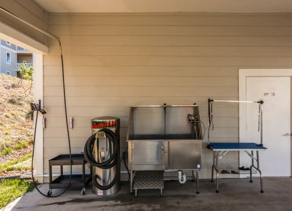 the outside of a house with two stainless steel tanks and a gas hose at Village at Westland Cove Apartments, Tennessee, 37922