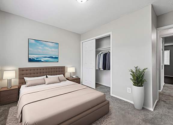 A bedroom with a large bed and a painting on the wall.