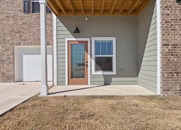 A house with a brown door and a brown window.