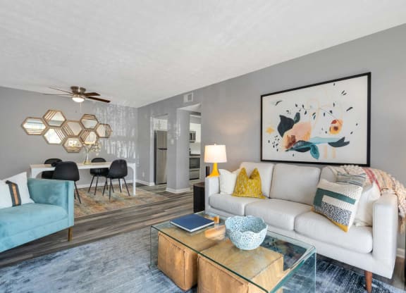 a living room with a couch and a coffee table at Station JTown, Kentucky, 40299