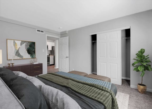 a bedroom with a bed and a closet at Station JTown, Louisville, KY, 40299