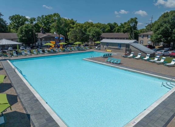 Louisville, KY Apartments For Rent - Enclave At Breckenridge - Large Pool With Spacious Sundeck, Lounge Chairs, And Umbrellas.