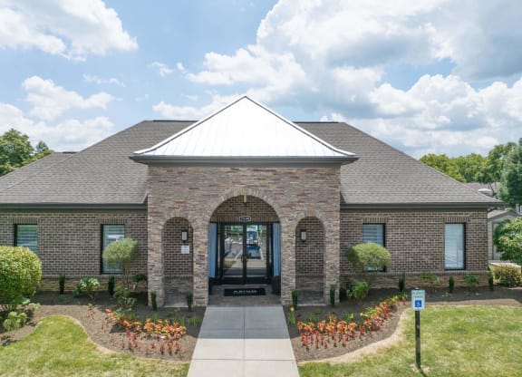 the front of a brick house with a walkway leading to the front door at Enclave at Breckenridge Apartments, Louisville, KY, 40220