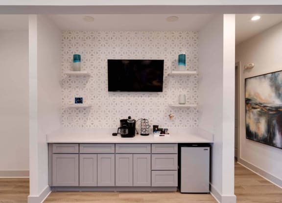 a kitchen with a counter and a tv on the wall at Enclave at Breckenridge Apartments, Louisville, 40220