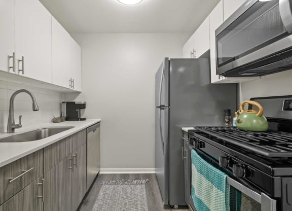 a kitchen with stainless steel appliances and a sink