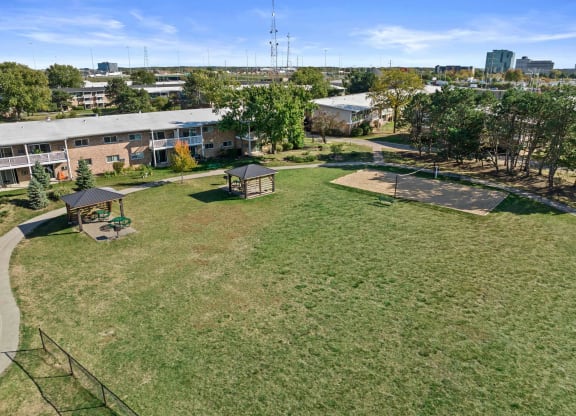 a park with a basketball court and a gazebo