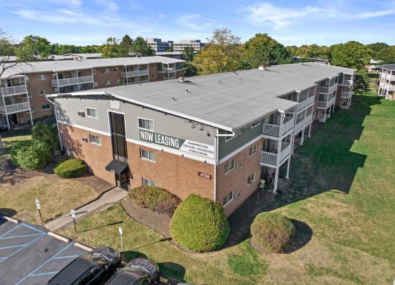 an aerial view of an apartment building with a solar panel roof