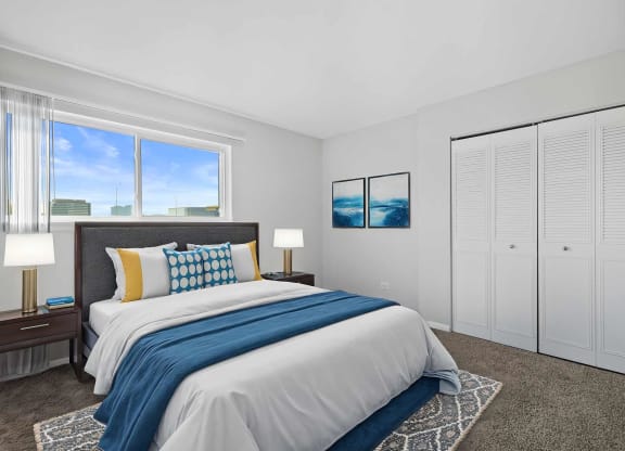 a bedroom with a bed and a window