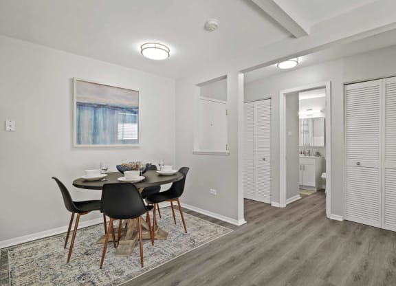 a dining room with a table and chairs