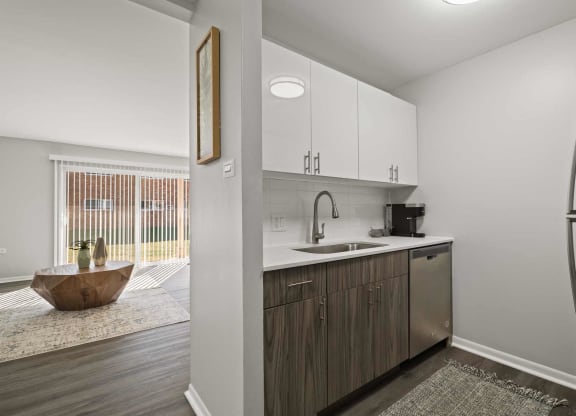 a kitchen with a sink and a refrigerator