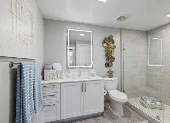 a white bathroom with a shower toilet and sink at Mayla Pompano, Pompano Beach, 33062