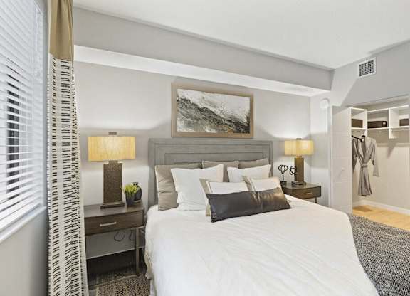 a bedroom with a bed and a closet at Mayla Pompano, Pompano Beach, Florida