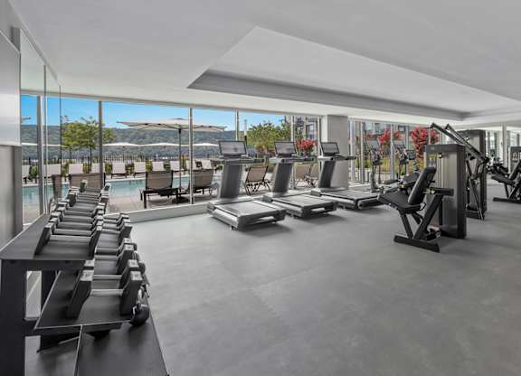 Gym with a row of treadmills at Hudson Piers, Yonkers, New York