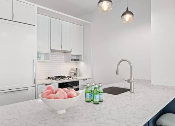 Kitchen with white cabinets at Hudson Piers, Yonkers