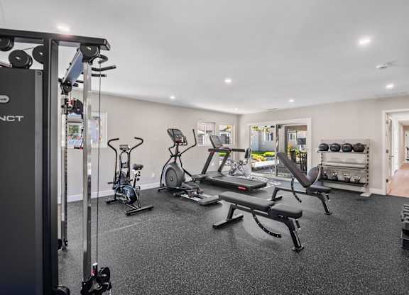 A well-equipped gym with a variety of exercise machines.
