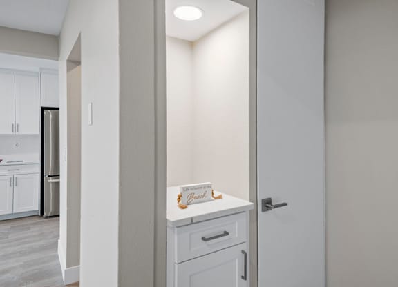 A white door with a sign on it in a kitchen.