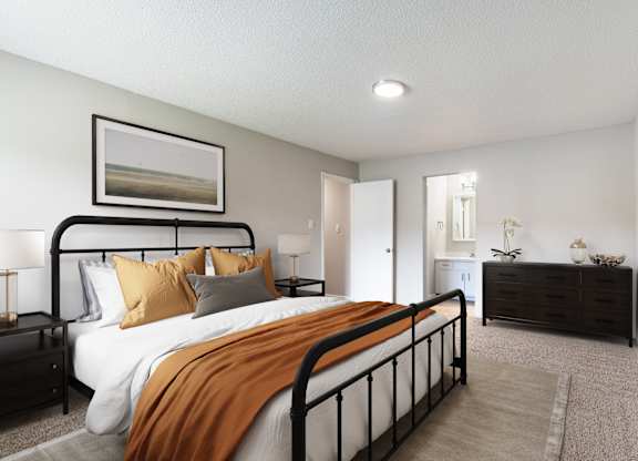 A bedroom with a large bed and a painting on the wall.
