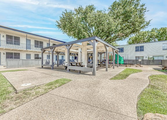 Covered outdoor pavilion with picnic seating area at Northwood Heights Apartments, Texas, 75248