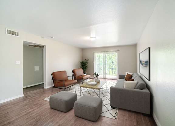 Spacious living room with contemporary furniture at Lumina Apartments, Texas
