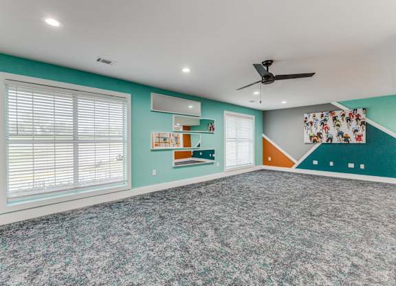 A room with a ceiling fan and a window with blinds. at Carisma, Dallas