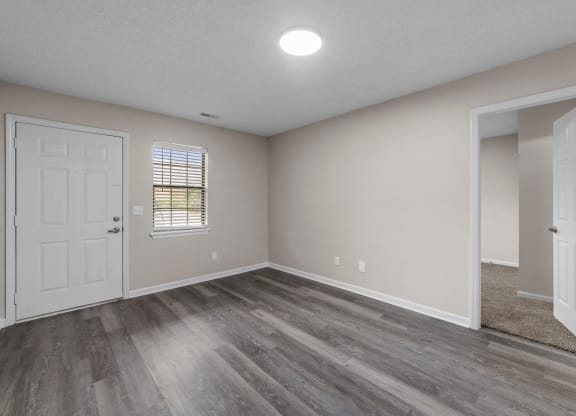 living room with faux wood flooring at Bennett, Greenville, NC, 27858