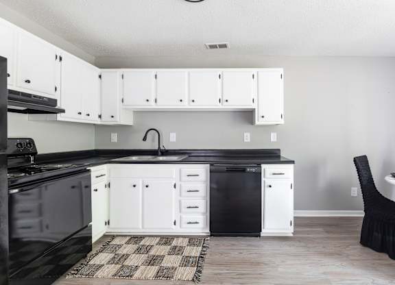 Kitchen With Black Appliances at Lauradale, Jacksonville, NC