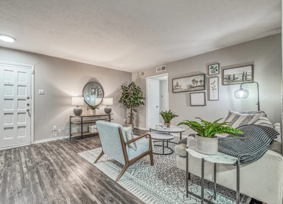 Inviting living room with coastal decor at Northwood Heights Apartments, Texas