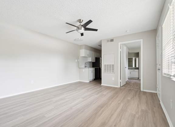 A room with a ceiling fan and light fixture. at Anson at North Hills, Raleigh, NC