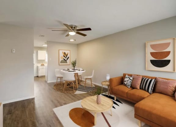a living room and dining room with a couch and a table