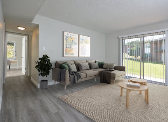 an open living room with a couch and a table