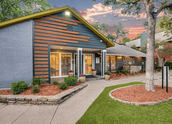 A leasing center is located in a building with a blue and orange exterior.