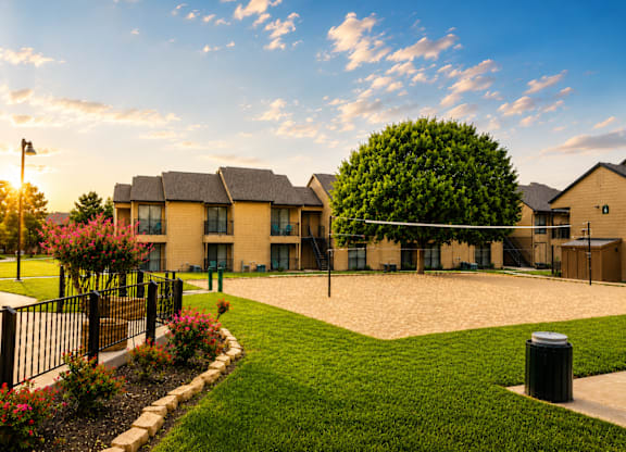 Sand volleyball court and community recreation area at Ridgeview Apartments, Texas