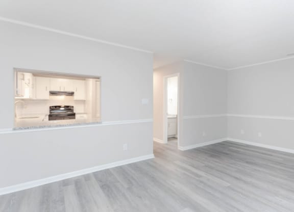 an empty living room with white walls and a fireplace  at Henley, North Carolina, 28311
