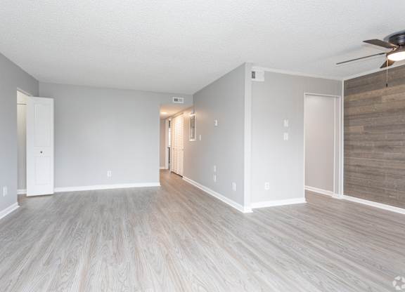 A spacious room with light wood flooring at Liberty Crossing, North Carolina, 28540
