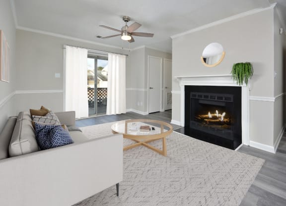 a living room with a fireplace and a couch