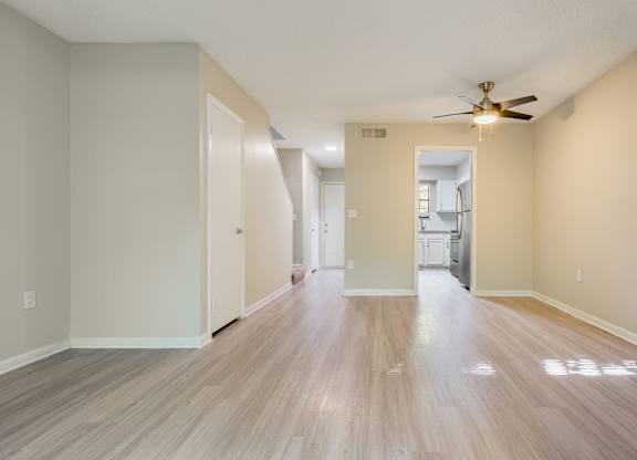 A room with a ceiling fan and light fixture. at Rosen at North Hills, Raleigh, 27609