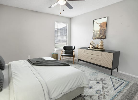 a bedroom with a bed and a dresser and a window