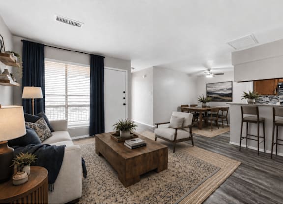 Open concept living and dining area with kitchen at Ridgeview Apartments, Sherman