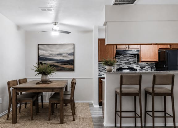 Dining area with breakfast bar and modern kitchen at Ridgeview Apartments, Texas