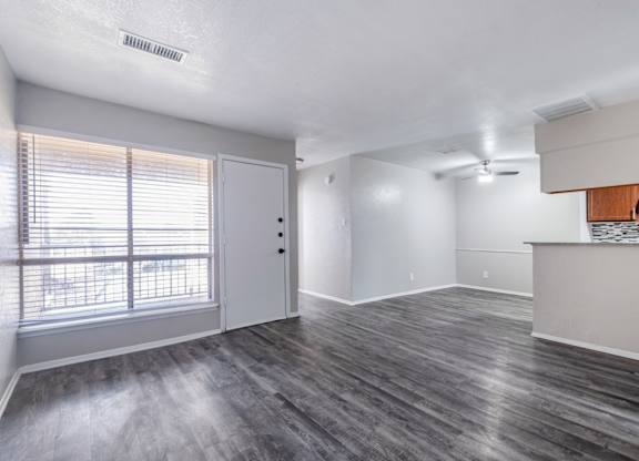 Open living space with vinyl plank flooring at Ridgeview Apartments, Sherman, TX 75092