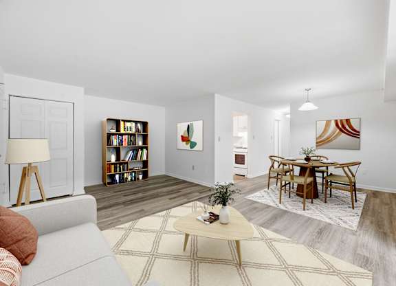 A living room with a grey couch and a coffee table.