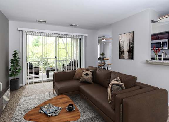 Brown couch in front of sliding door